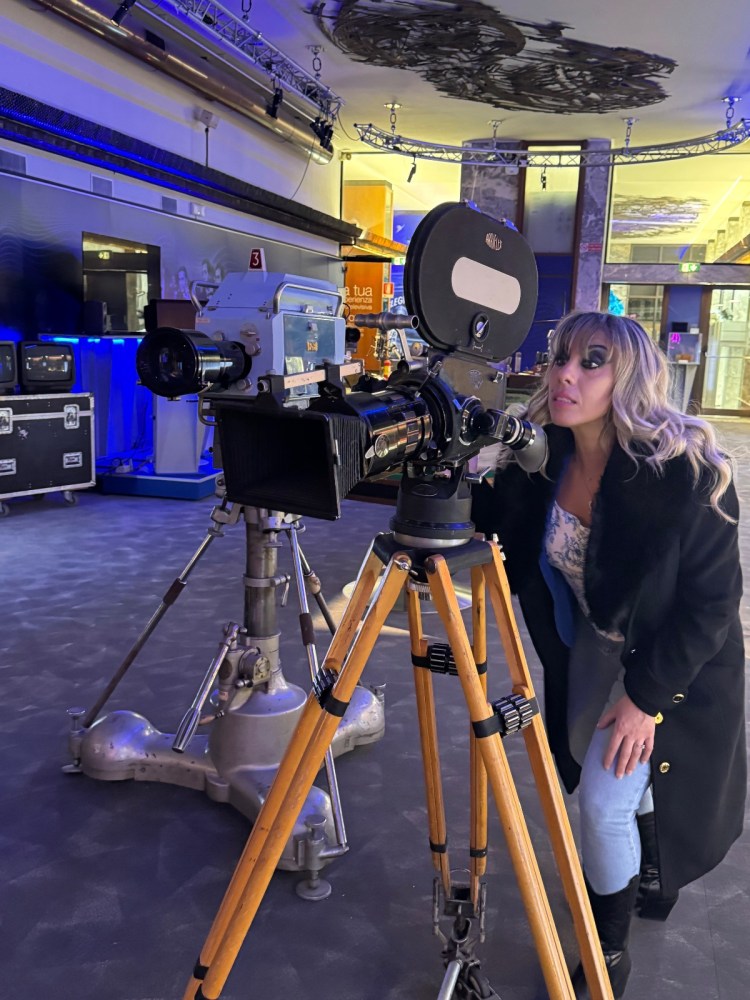 a person standing in front of a tripod