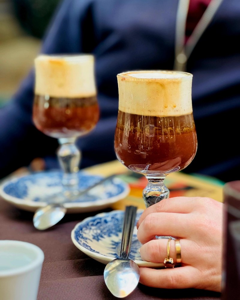 a cup of coffee and a glass of wine